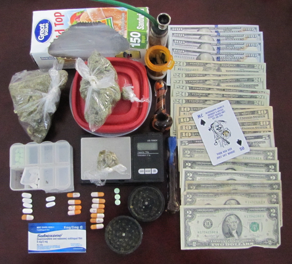 Image of money and drugs. 