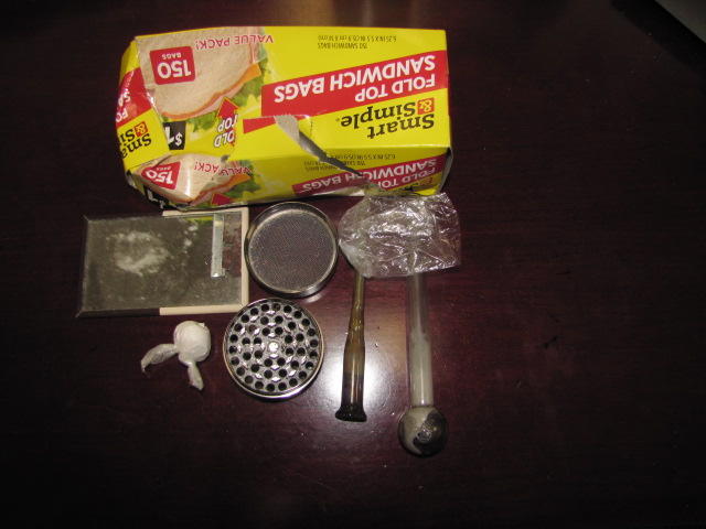 Seized drugs displayed on table.