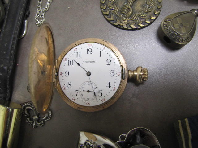 Close up of gold pocket watch.