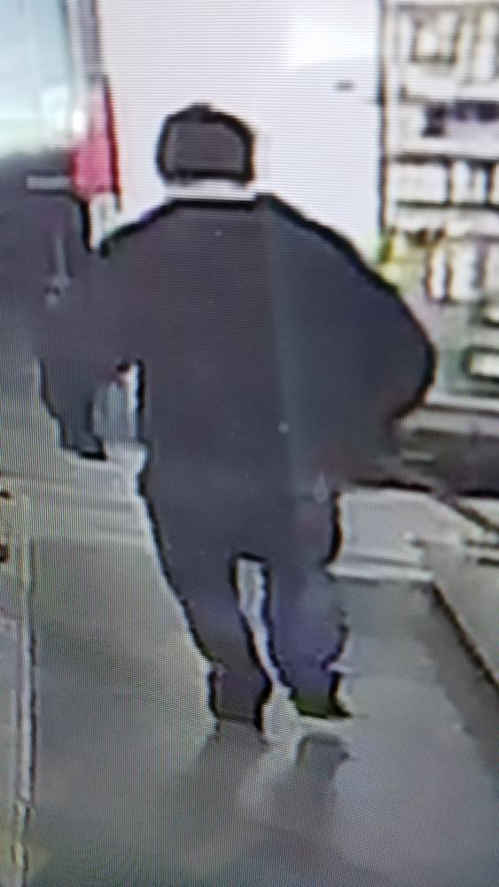 Image of back of potential burglar. 